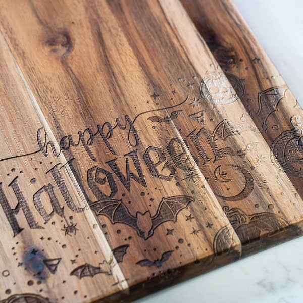 Whimsical Halloween Wooden charcuterie board adorned with Cheerful Bats, Playful Pumpkin, and Shimmering Stars for a Festive Kitchen Delight