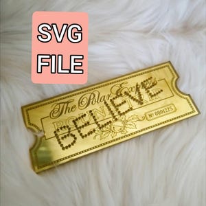May include: A gold-colored ticket with the words "The Polar Express" and "BELIEVE" in a decorative font. The ticket has a serial number and is labeled "SVG FILE" in a pink box.