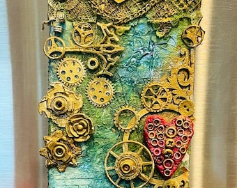 Steampunk mixed media art fridge magnet and wall art both . Title — ‘Heart song’ handmade gift