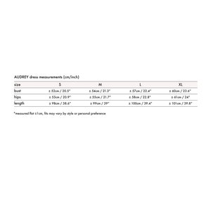 May include: A chart showing dress measurements in inches and centimeters for sizes S, M, L, and XL. The measurements include bust, hips, and length.