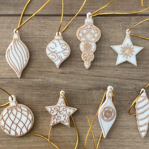 Victorian style Christmas tree ornaments in white with gold outline 1.5”