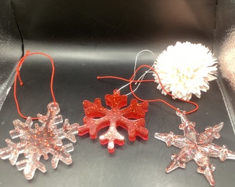 3” Christmas snowflake ornaments. Clear and red glitter and red with red glitter