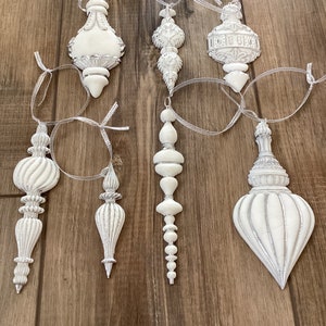 Handmade Victorian style Christmas tree ornaments in white with silver outline
