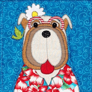 May include: A cartoon bulldog wearing sunglasses and a flower on its head. The bulldog is wearing a red, white, and blue shirt with a tropical print. The background is a blue fabric with a white swirl pattern.