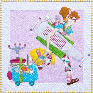 May include: A colorful quilted illustration of a woman carrying a large ironing board and a rolling suitcase filled with sewing supplies. The woman is wearing a pink and white striped shirt, floral pants, and glasses. The background is a light purple with a swirl pattern.
