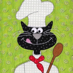 May include: A black cat wearing a white chef's hat and a red polka dot bow tie, holding a wooden spoon. The cat has a playful expression and is set against a green background with swirls.
