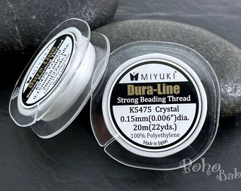 Può includere: Bobina bianca di filo per perline resistente Dura-Line di Miyuki. L'etichetta riporta "K5475 Crystal 0,15 mm (0,006") dia. 20 m (22 yds.) 100 % Polietilene Prodotto in Giappone"
