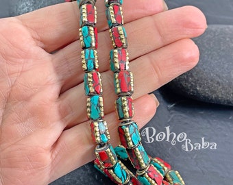 May include: A double strand necklace made of turquoise and red stone beads with gold accents. The beads are rectangular and have a mosaic pattern. The necklace is approximately 20 inches long.