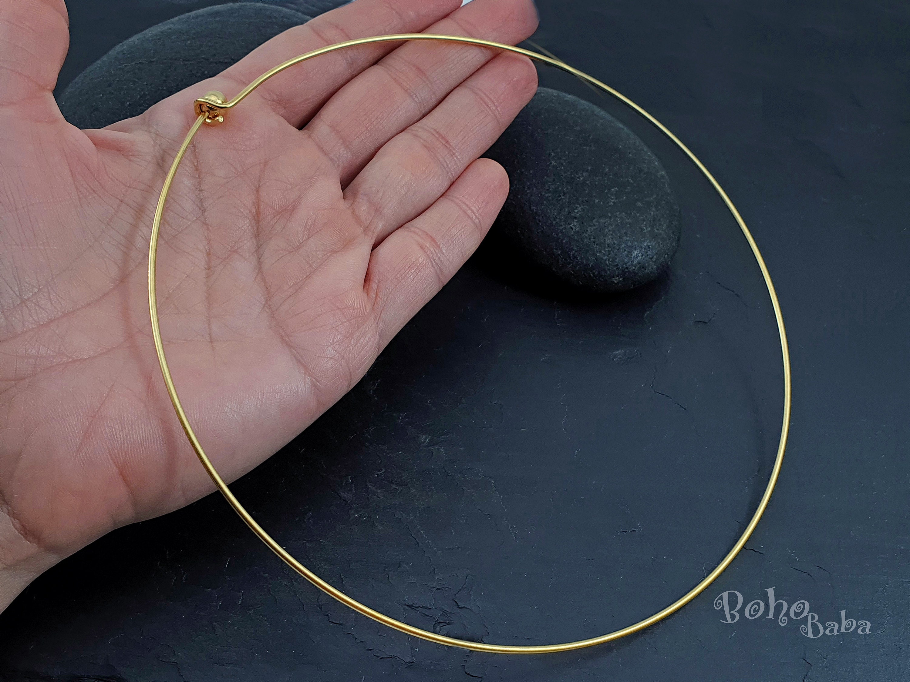 Lot - Group of six costume necklaces include: wire choker necklace with  brown tone beads; gold tone cylindrical shape, length 24 inches; twisted  multi-strand bead choker; gold tone rope with dangling matching