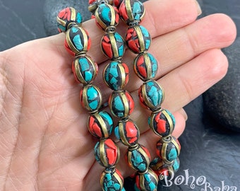 May include: Three beaded bracelets with turquoise and coral colored stones set in brass. The bracelets are stacked on top of each other and have a gold colored trim.
