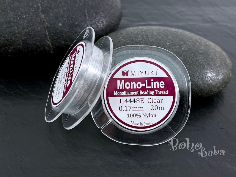 May include: A spool of clear Miyuki Mono-Line monofilament beading thread. The label reads "H4448E Clear 0.17mm 20m 100% Nylon Made in Japan".