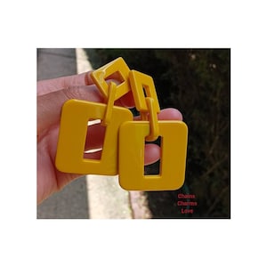 Grote gele harsoorbellen: vierkante boho-hangers