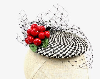 Black and white patterned cocktail hat with vintage cherry cluster and black silk veiling