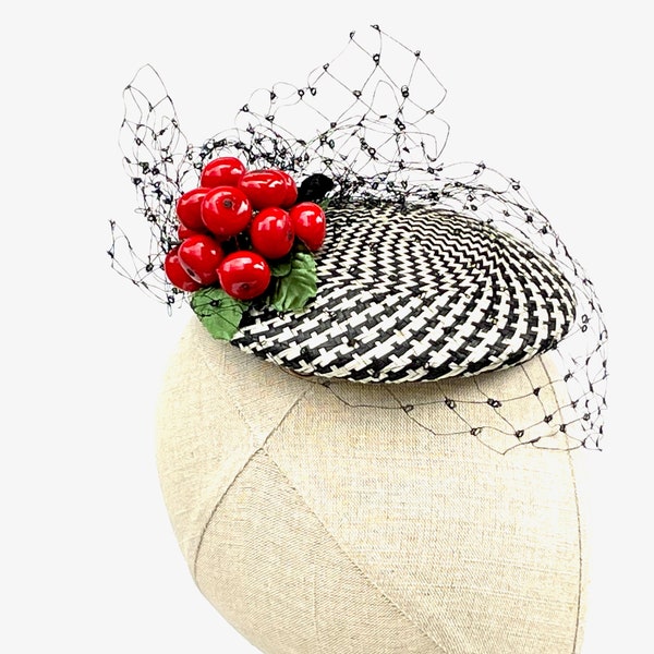 Black and white patterned cocktail hat with vintage cherry cluster and black silk veiling