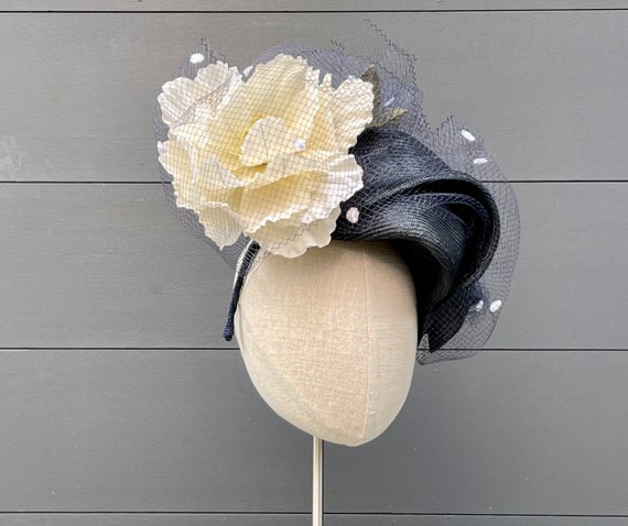 Navy blue sculpted parasisal straw fascinator with large cream peony and vintage chenille dot veiling