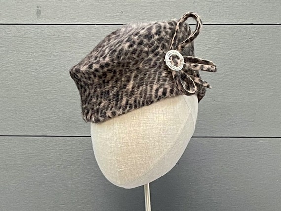 Animal print long-pile melusine fur felt toque hat with vintage beaded belt buckle and felt loops