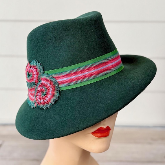 Forest green velour felt fedora with striped ribbon band and cockades