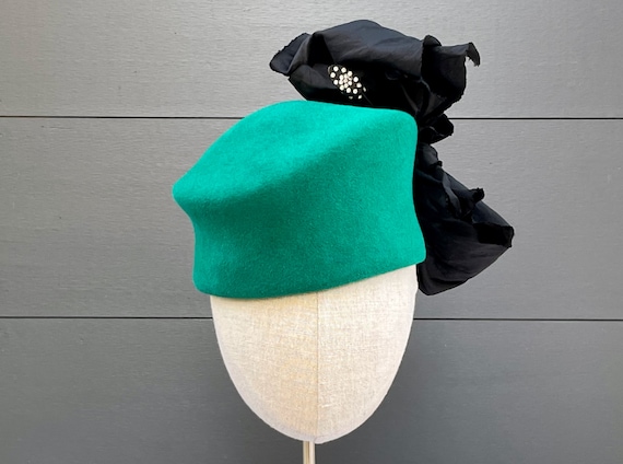 Teal green fur felt toque with black silk taffeta bow and antique rhinestone hatpin