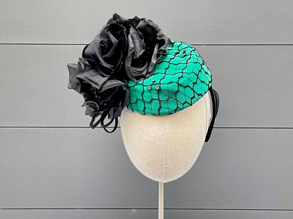 Emerald green silk pillbox with black veiling overlay, vintage black silk & velvet roses, and vintage rhinestones