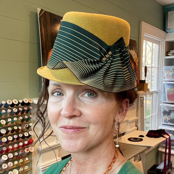 Mustard yellow velour felt porkpie hat with extra-wide vintage forest green and mustard striped ribbon band and brass beads