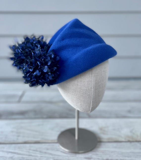 Cobalt blue velour felt asymmetrical cap with flocked tulle pompoms