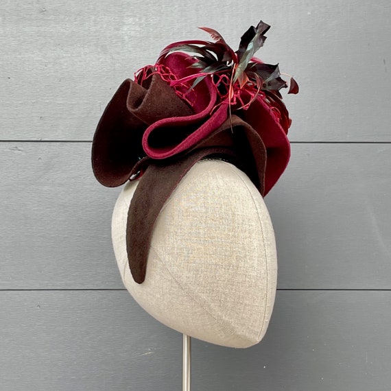 Burgundy and brown sculpted felt hat with vintage veiling and coque feather spray