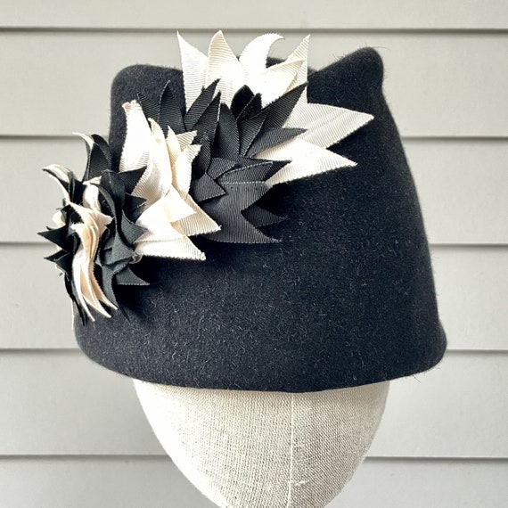 Black velour felt toque with ivory and black cut ribbon trim