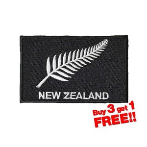 May include: Black embroidered patch with a white fern and the text "NEW ZEALAND".