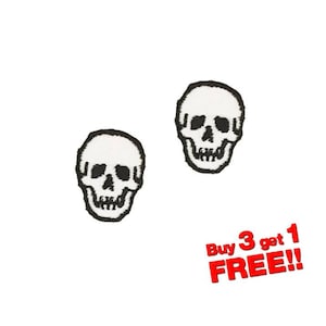 May include: Two white skull iron-on patches with black outlines. The text "Buy 3 get 1 FREE!" is in red letters.