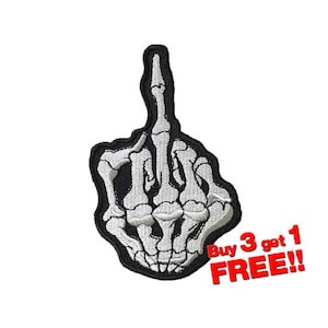 Puede incluir: Mano de esqueleto blanca haciendo el dedo medio, bordada en un parche negro. El parche tiene el texto "Buy 3 get 1 FREE!!" en rojo.