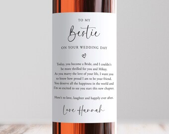 May include: A white wine bottle label with a wedding message for a friend. The label reads "To my Bestie on your wedding day." and includes a sweet message about the bride's wedding day. The label is signed "Love Hannah".