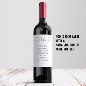 May include: A wine bottle with a red cap and a white label. The label reads "Table 1" and lists names. Text on the right indicates the label size is 9cm x 12cm for a straight-bodied wine bottle.