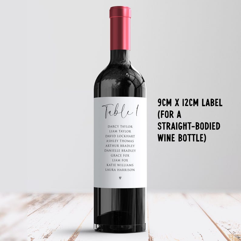 May include: A wine bottle with a red cap and a white label. The label reads "Table 1" and lists names. Text on the right indicates the label size is 9cm x 12cm for a straight-bodied wine bottle.