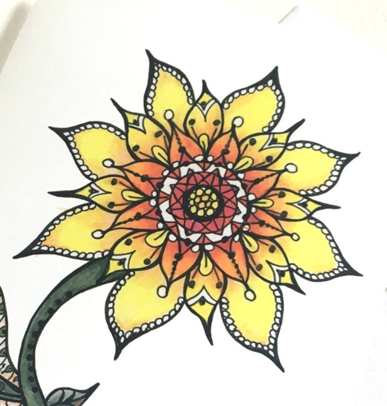 May include: A yellow and orange mandala sunflower with black outlines and white dots. The sunflower has a green stem.