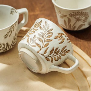 Handcrafted Ceramic Coffee Mug: Rustic Botanical Design