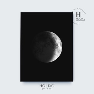 May include: A black and white digital print of a crescent moon on a black background. The print is titled "HOLIXO prints".