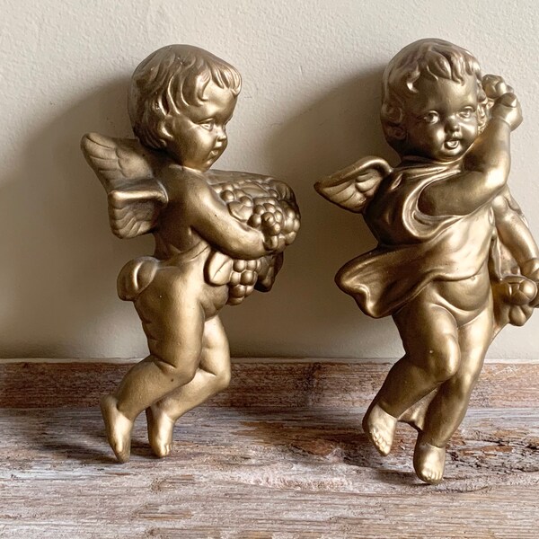 Vintage Hollywood Regency style gold cherub wall hangings, vintage gold cherub wall hangings, vintage gold cherubs, gold cherub wall hanging