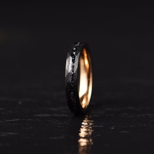 Womans and ladies wedding ring set crafted in meteorite hammered black tungsten and rose tungsten with a flat profile and a comfort fit interior. Rings By Pristine