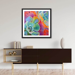 May include: Close-up of a vibrant succulent plant with overlapping layers of petals in shades of blue, green, orange, red, and purple.