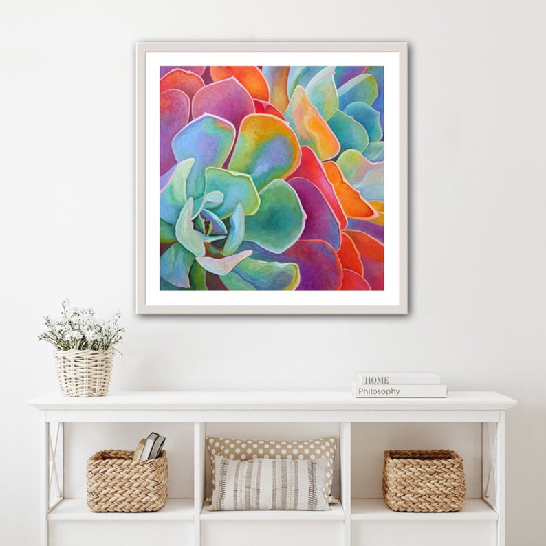 May include: Close-up of a vibrant succulent with overlapping layers of petals in shades of pink, orange, green, and blue.