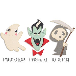 May include: Three Halloween-themed paper cutouts: a friendly ghost with googly eyes, a vampire with fangs and a red cape, and a grim reaper with a scythe. The text below reads "Fab-Boo-Lous! Fangtastic! To Die For!"