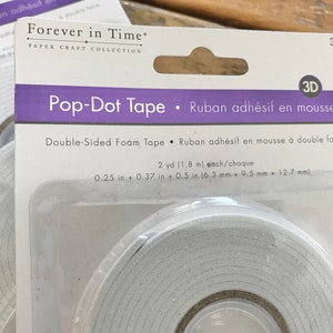 May include: A package of 3 double-sided foam tape rolls, labeled "Pop-Dot Tape" and "Ruban adh&eacute;sif en mousse". Each roll is 2 yards (1.8 meters) long and measures 0.25 inches (6.3 mm) wide.