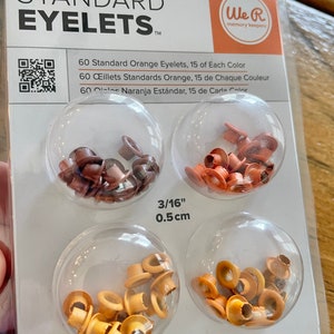 May include: Package of 60 standard orange eyelets, 15 of each color: brown, orange, and yellow. The eyelets are 3/16 inch (0.5 cm) in diameter and are designed to be used with a Crop-A-Dile tool.  We R memory keepers.