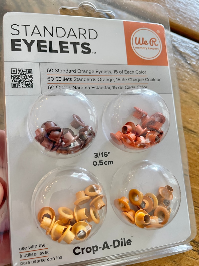 May include: Package of 60 standard orange eyelets, 15 of each color: brown, orange, and yellow. The eyelets are 3/16 inch (0.5 cm) in diameter and are designed to be used with a Crop-A-Dile tool.  We R memory keepers.