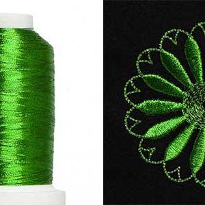 May include: A spool of bright green embroidery thread next to a green floral embroidery design on black fabric. The thread is on a white spool. The floral design is a stylized flower.