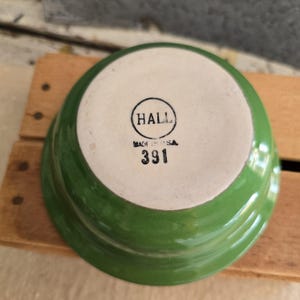 May include: A set of three ceramic nesting bowls in shades of blue, green, and white. The bowls feature a speckled glaze and a simple, modern design. The largest bowl is approximately 6 inches in diameter.