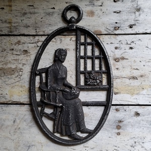 Vintage Cast Iron Wall Decor: Scandinavian Woman by Window