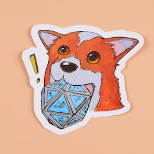 May include: A cartoon sticker of a red and white dog with a blue and silver 20-sided die in its mouth. The dog has a surprised expression and an exclamation point above its head.