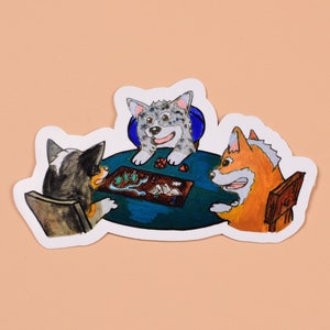 May include: Three cartoon dogs sitting at a table playing a board game. The dogs are a grey and white dog, a brown and white dog, and an orange dog. The board game has a blue and green board with a variety of colorful pieces.