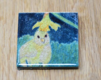 Demure baby chick with a daffodil flower hat square ceramic tile magnet